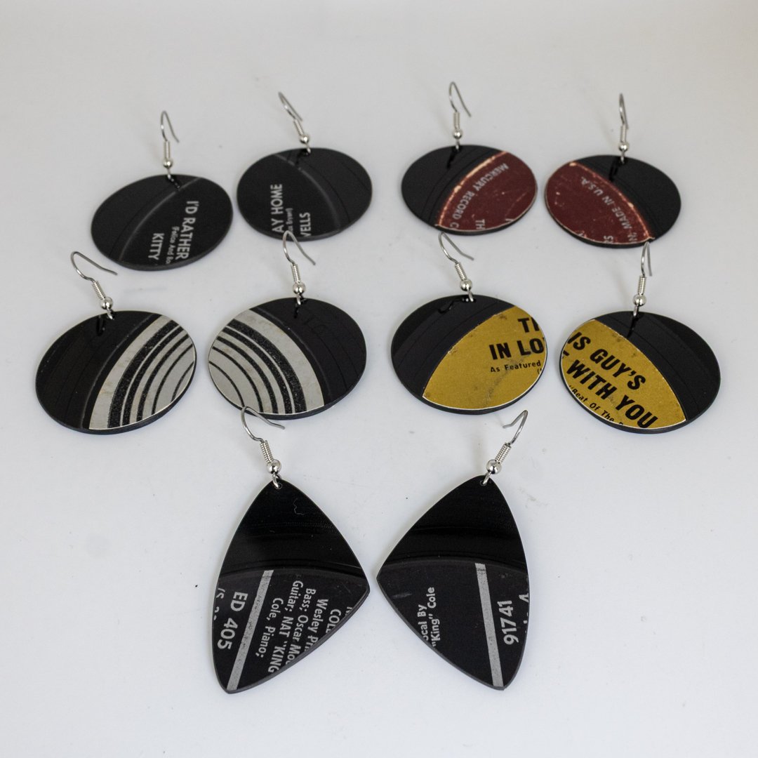 Deep Cuts made-to-order earrings featuring rich vintage record-label colors and authentic vinyl grooves