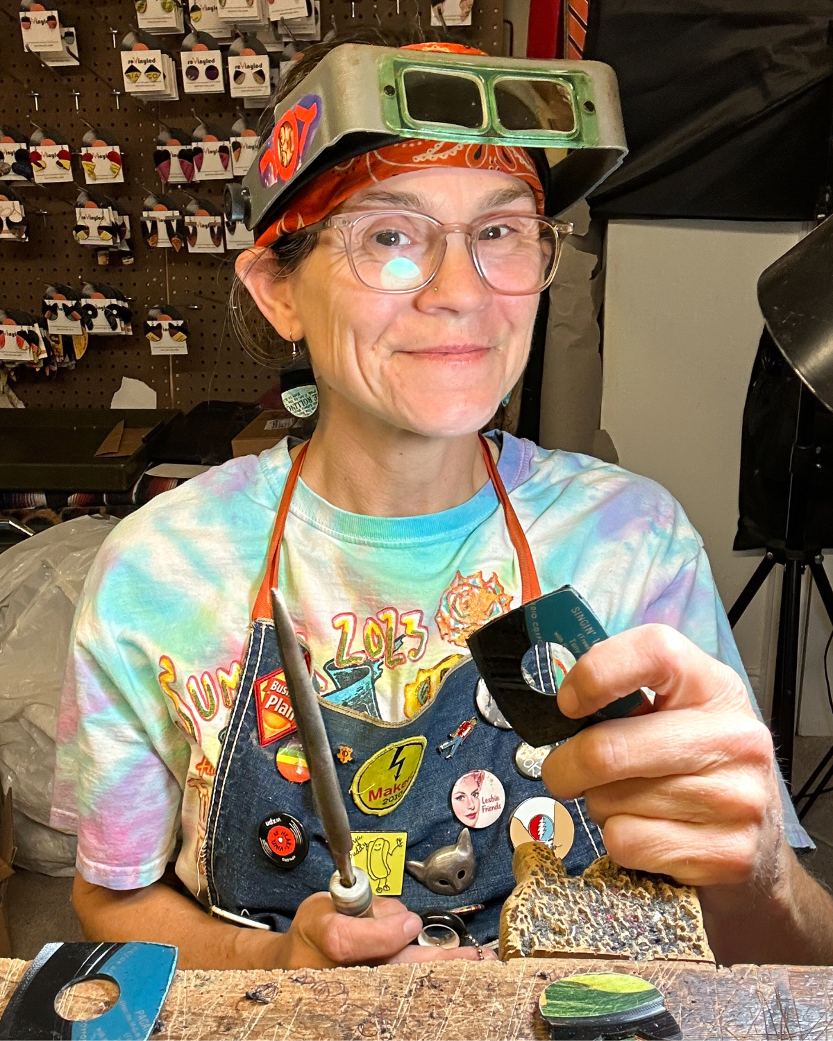 Leah Coonan handcrafting reVinyled jewelry at her Philadelphia workbench