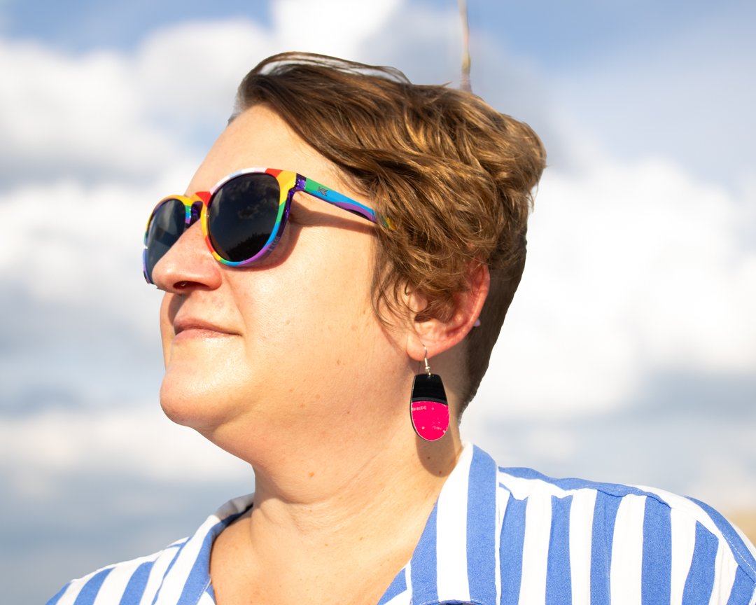 Pink reVinyled vinyl record earrings being worn