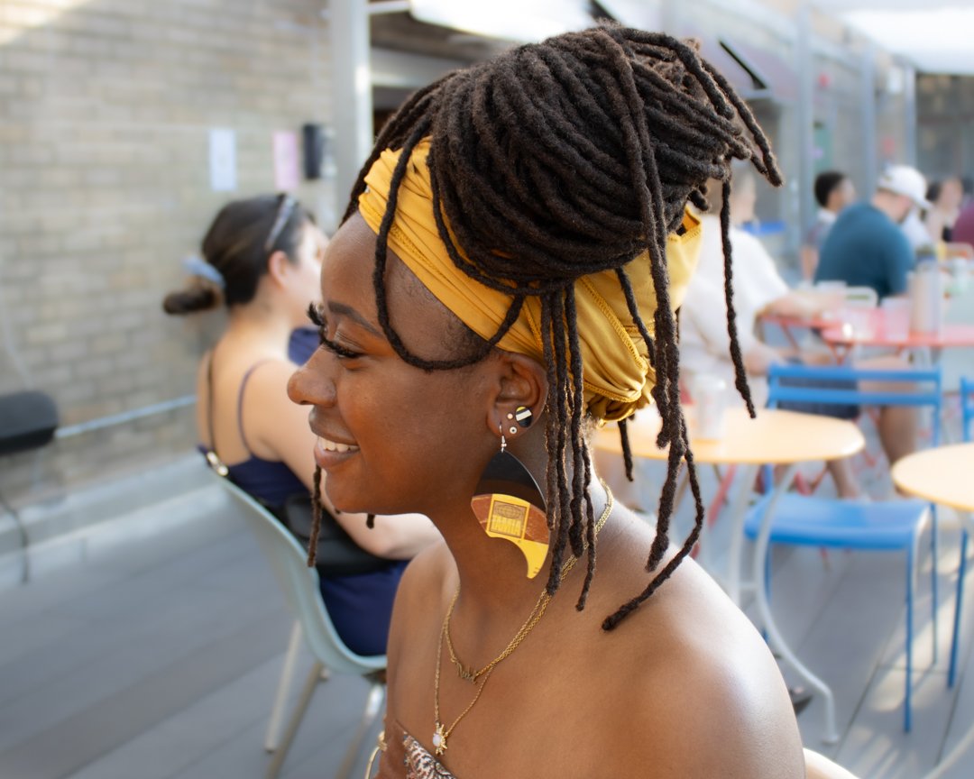 Colorful reVinyled vinyl record earrings being worn