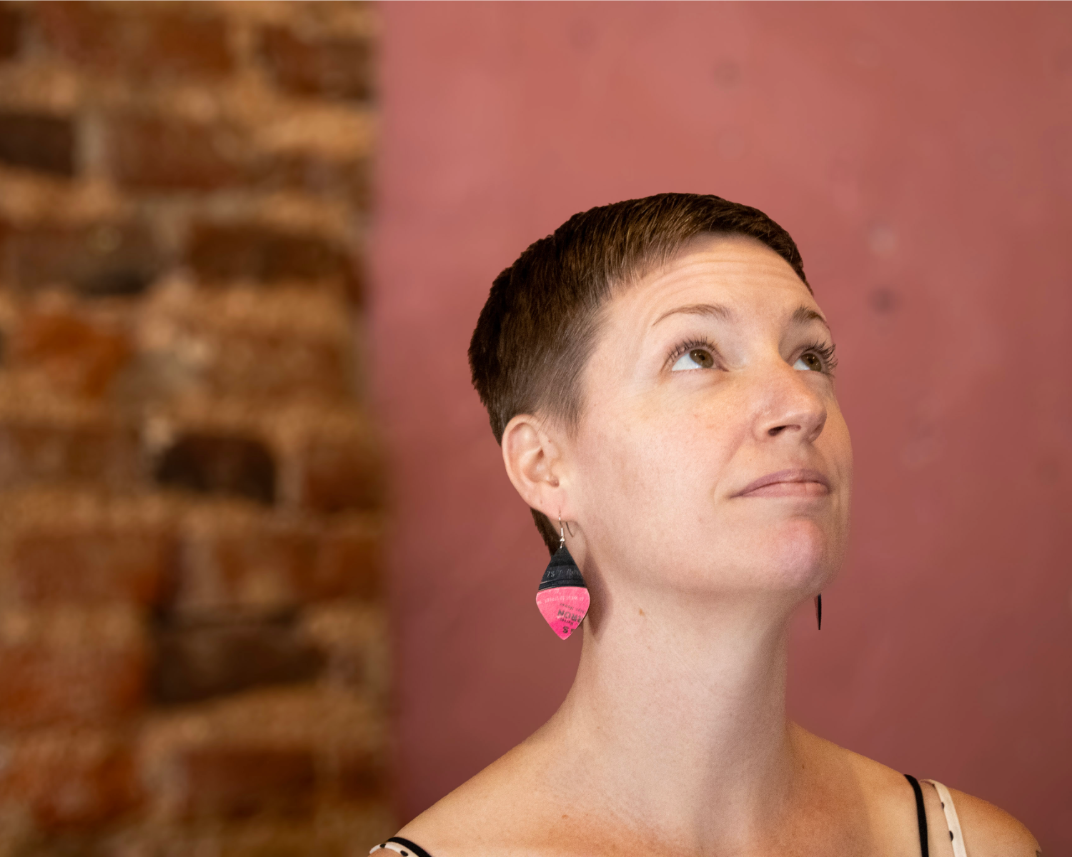 Model wearing one-of-a-kind reVinyled earrings