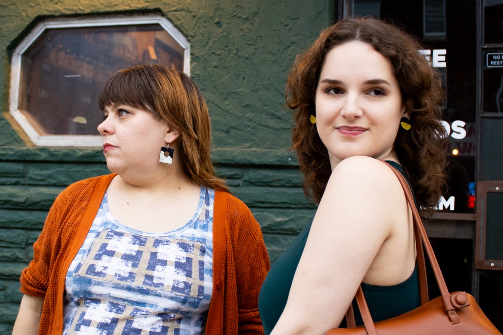 People wearing handcrafted reVinyled earrings made from rescued vinyl records
