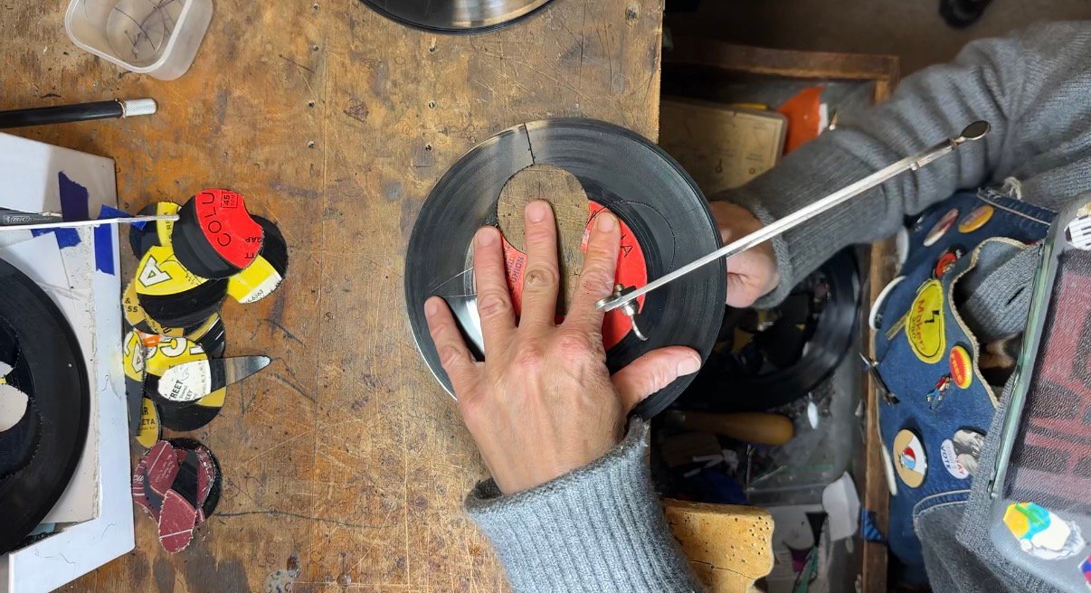 Small reVinyled pieces showing how rescued record material continues to be used through successive cutting rounds