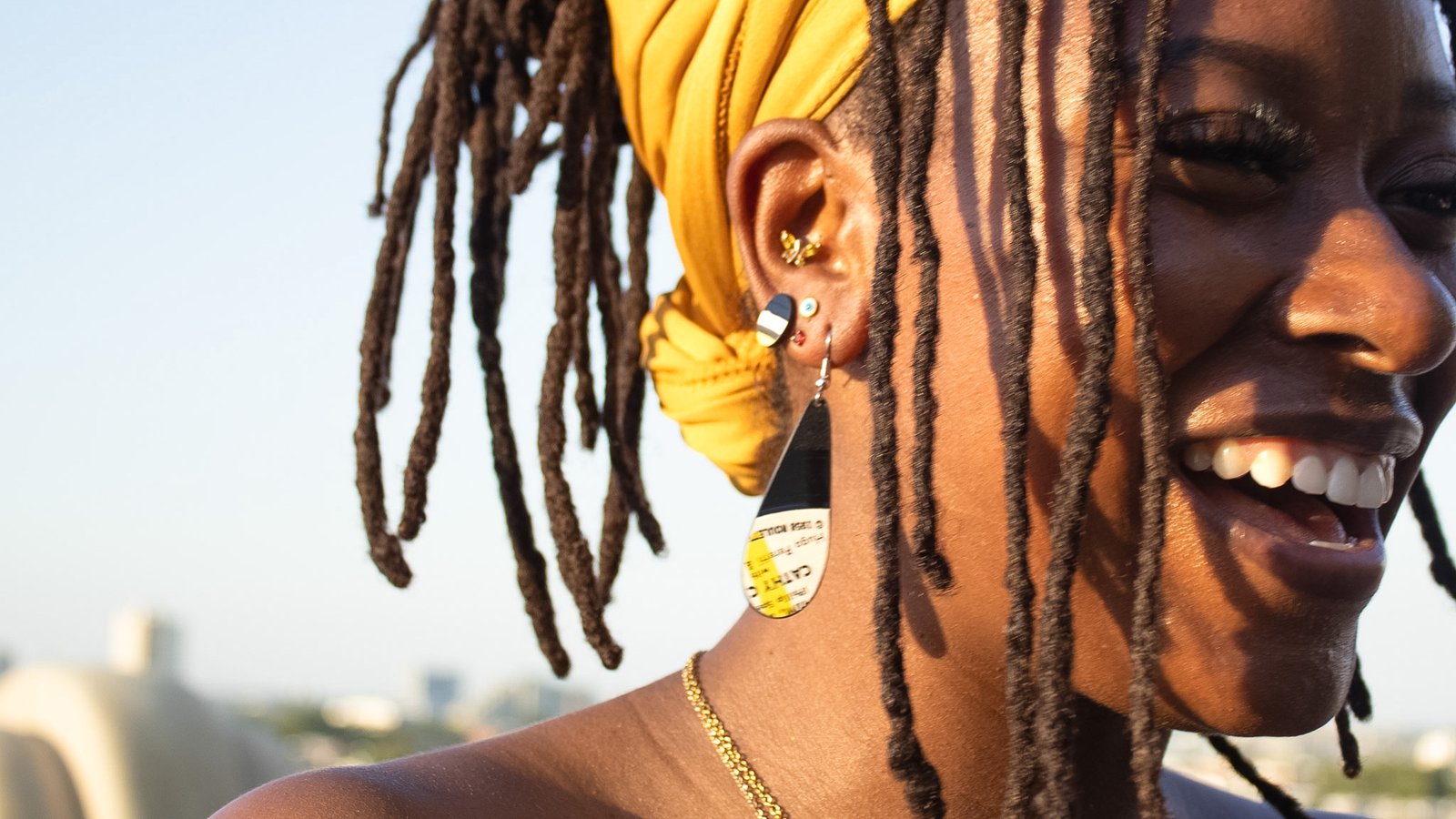 White long tear reVinyled earrings being worn