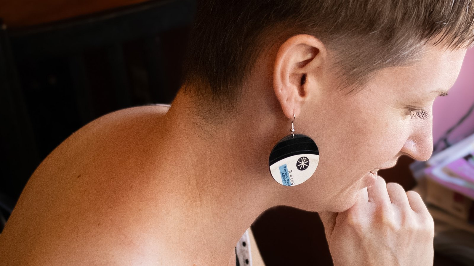 White round reVinyled vinyl record earrings being worn